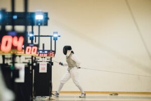 fencer fencing with electric scoring equipment