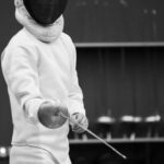 fencer holding an epee sword